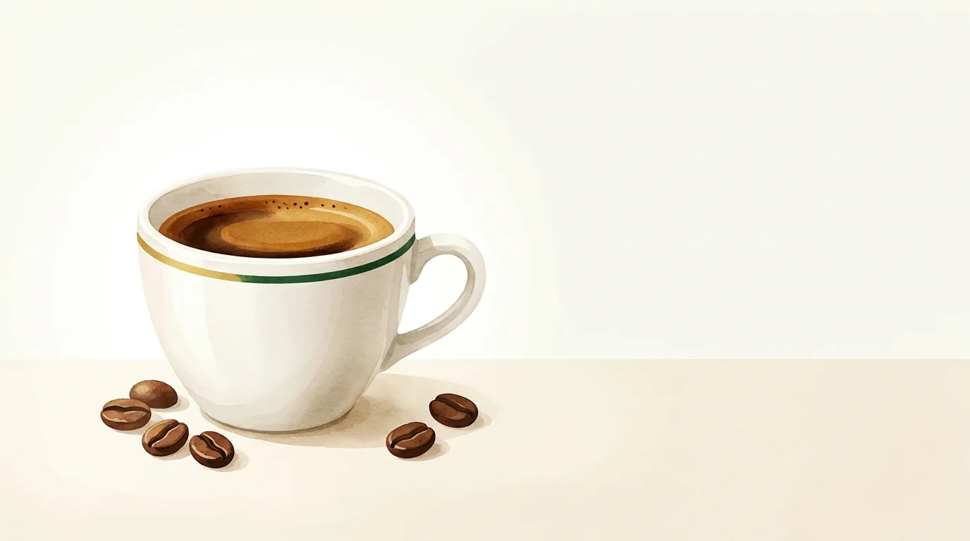 Mocne podwójne espresso w białej filiżance z ciemną, gęstą cremą
